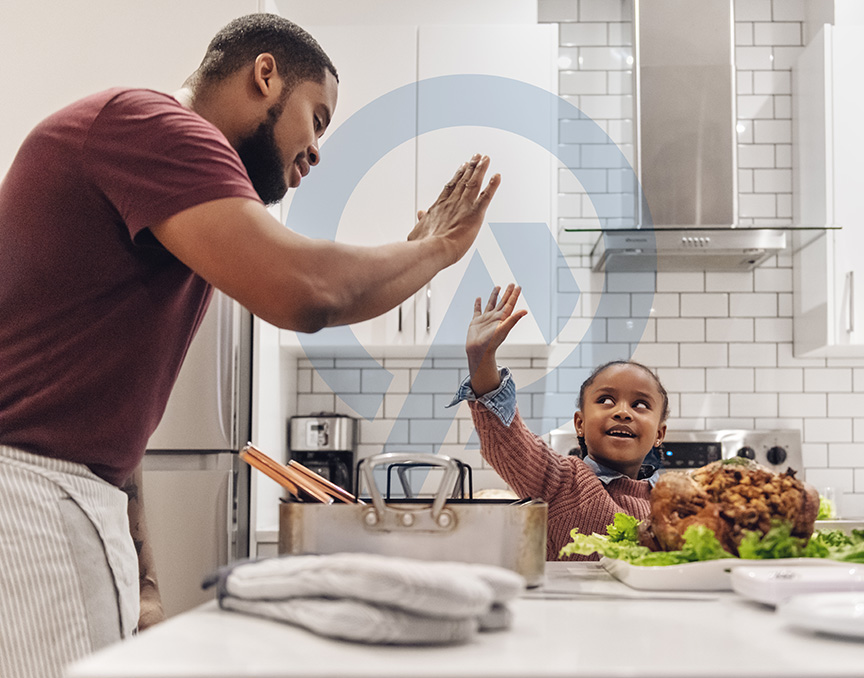 African-american father and daughter preparing Thanksgiving dinner